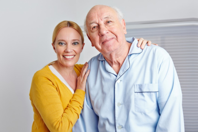 caregiver and senior woman smiling